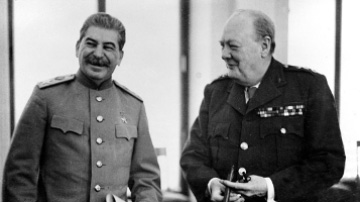 (Premier Joseph Stalin and Prime Minister Winston Churchill share a light moment. Source: Paul Popper, Getty Images)
